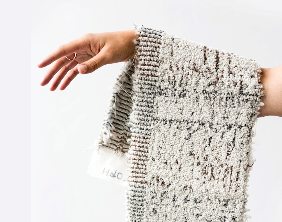 An arm with carpet draped over it