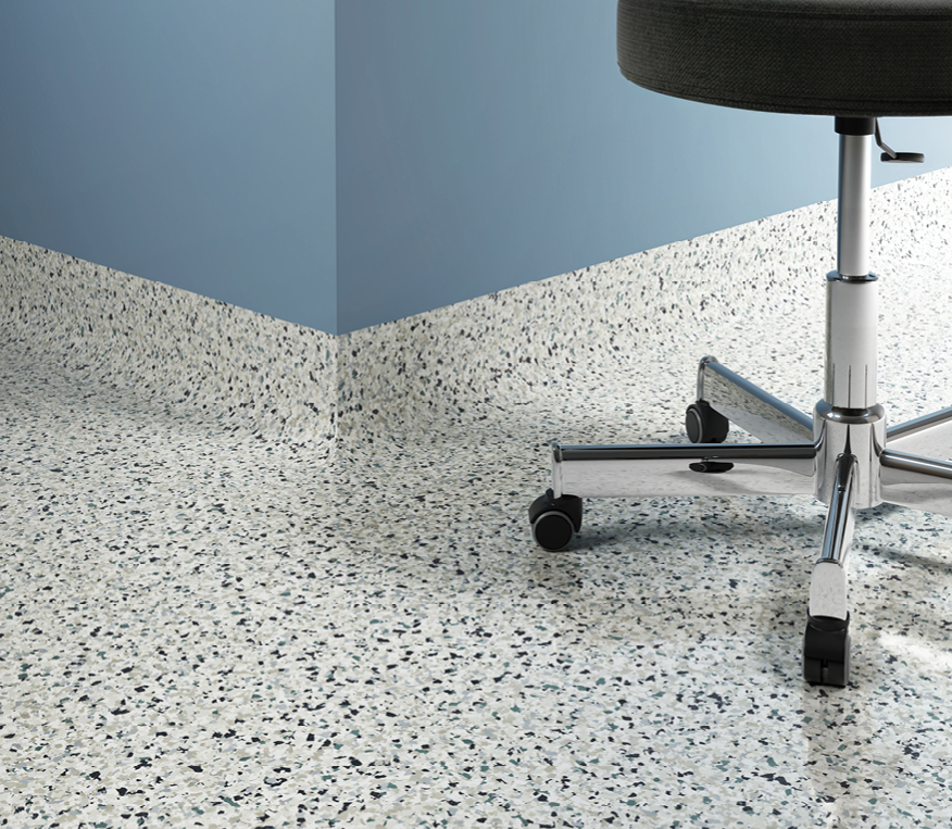 A round rolling stool on resin flooring